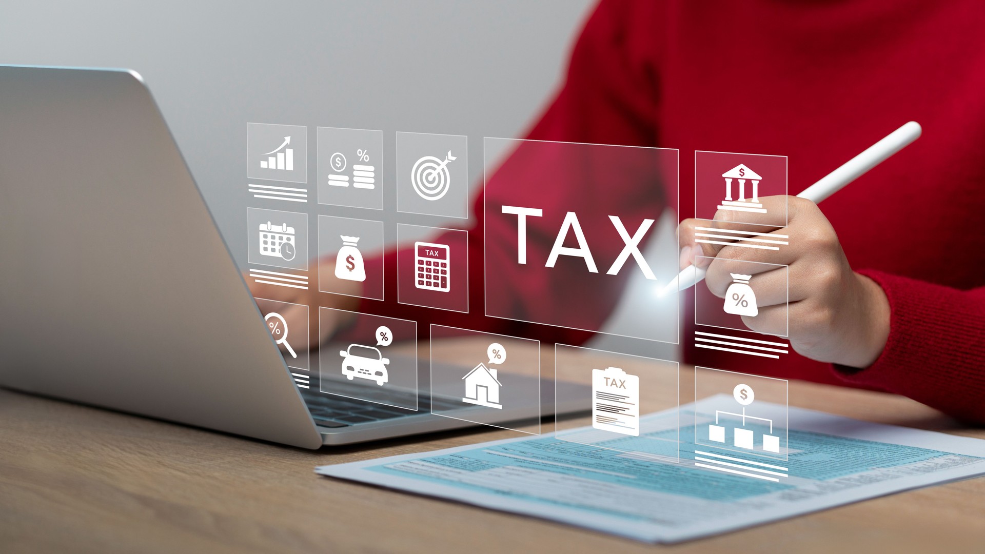 The concept tax and financial management. complete Individual income tax return form online for tax payment, calculates taxes,  tax documents. Businessman use laptop show icon on virtual screen.